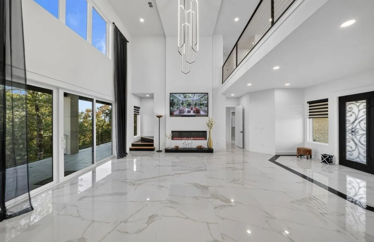 Great room with large-format marble-look porcelain floors